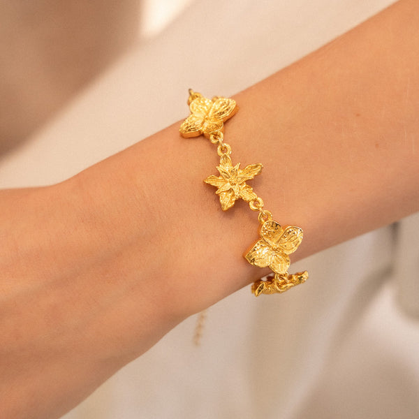 PULSERA CON DIJE DE FLORES
