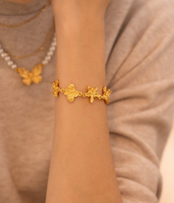 PULSERA CON DIJE DE FLORES
