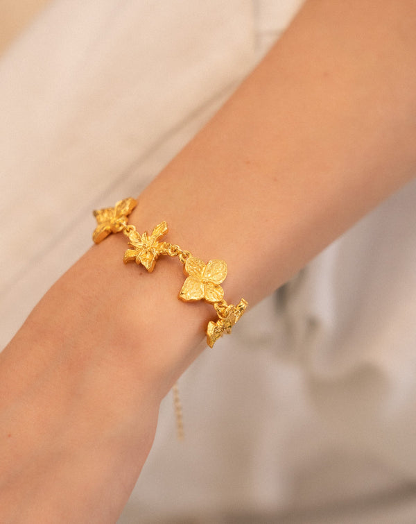 PULSERA CON DIJE DE FLORES